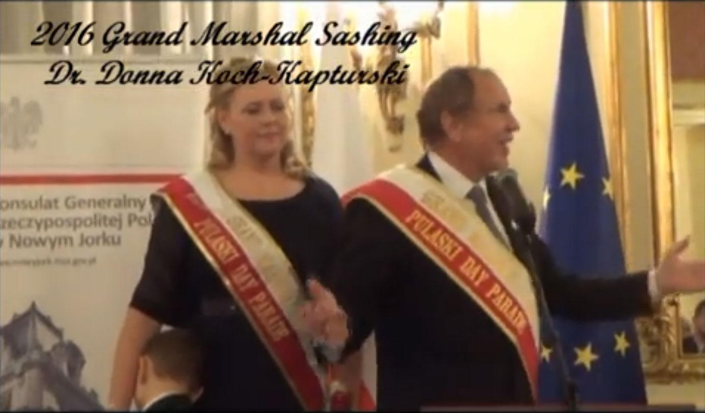 A man and a woman in formal attire and sashes